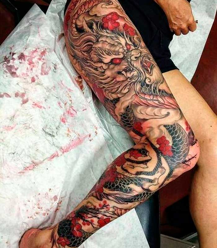 tatuajes de dragones en la pierna