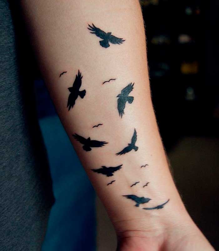 tatuajes de aves en los brazos