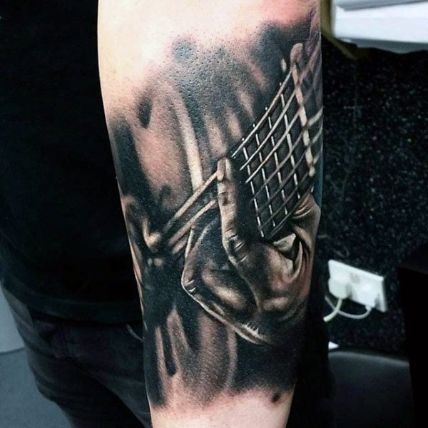 tatuajes de musica en el brazo