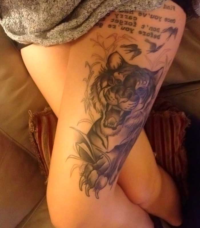 tatuajes de tigres en la pierna