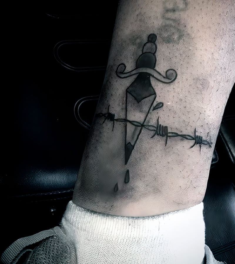 tatuajes de alambre de puas en la pierna 3