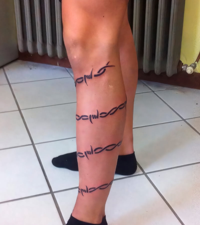tatuajes de alambre de puas en la pierna 4