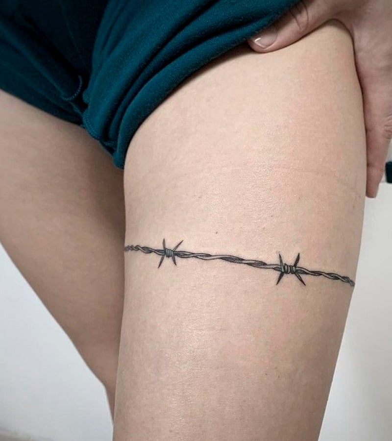 tatuajes de alambre de puas en la pierna 5